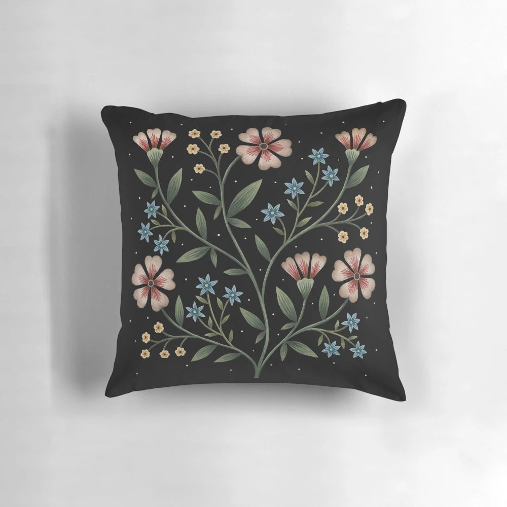 Decorative pillow with a vibrant floral design in a dark, nighttime palette.