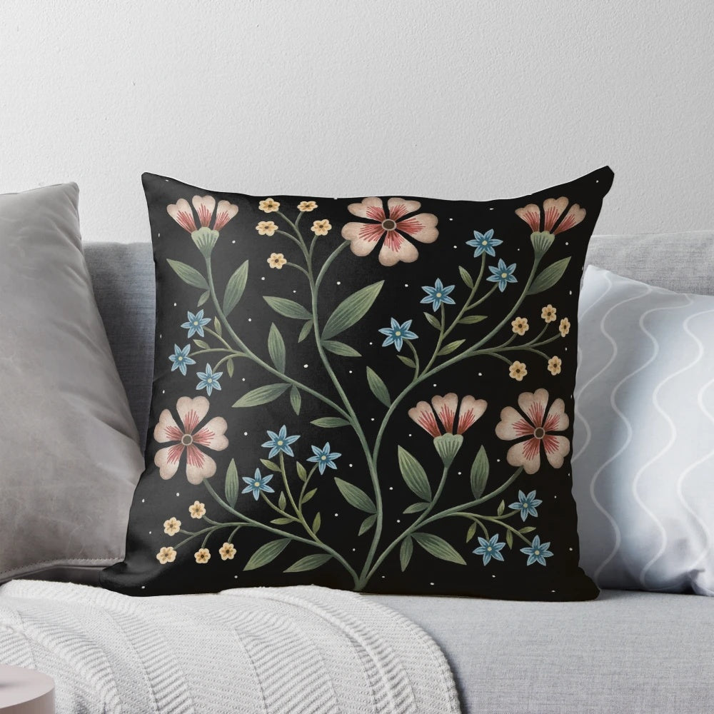 Decorative pillow with a vibrant floral design in a dark, nighttime palette.