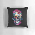 Vibrant floral skull design printed on a blue throw pillow for modern, bohemian interior styling.