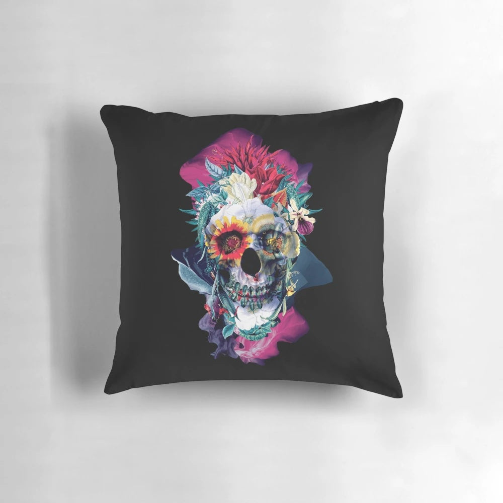 Vibrant floral skull design printed on a blue throw pillow for modern, bohemian interior styling.