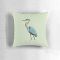 Vibrant blue and gray great blue heron bird on a decorative pillow
