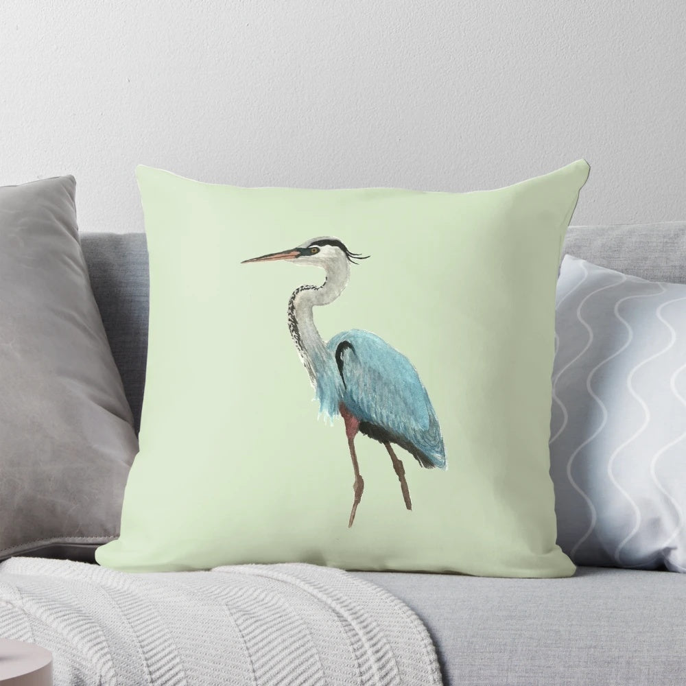 Vibrant blue and gray great blue heron bird on a decorative pillow