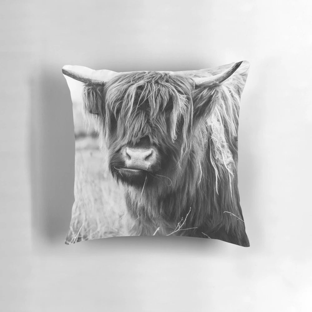 Artistic black and white watercolor portrait of a majestic Highland cow