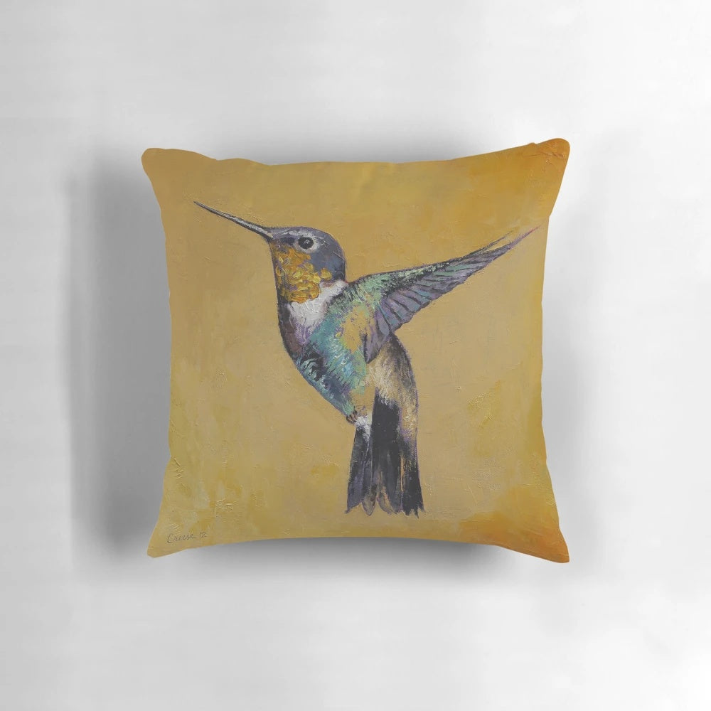 Hummingbird pillow featuring a vibrant abstract oil painting of a hummingbird in flight