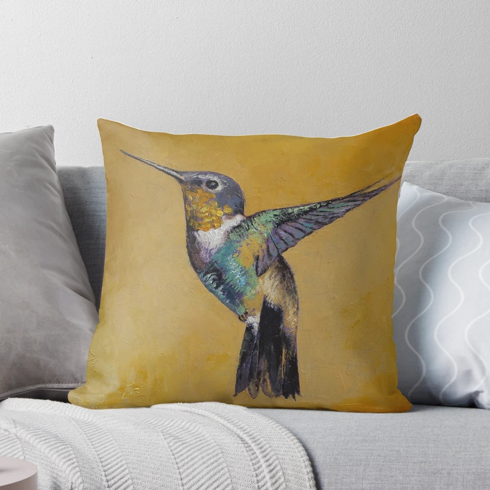 Hummingbird pillow featuring a vibrant abstract oil painting of a hummingbird in flight