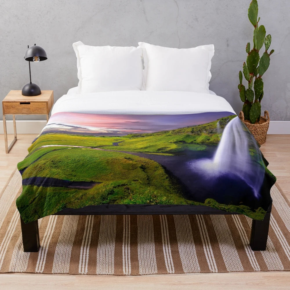Plush blanket featuring a stunning photograph of the Seljalandsfoss waterfall in Iceland
