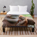 Orang Utan Plush Blanket featuring a captivating portrait of a mother and infant orang utan