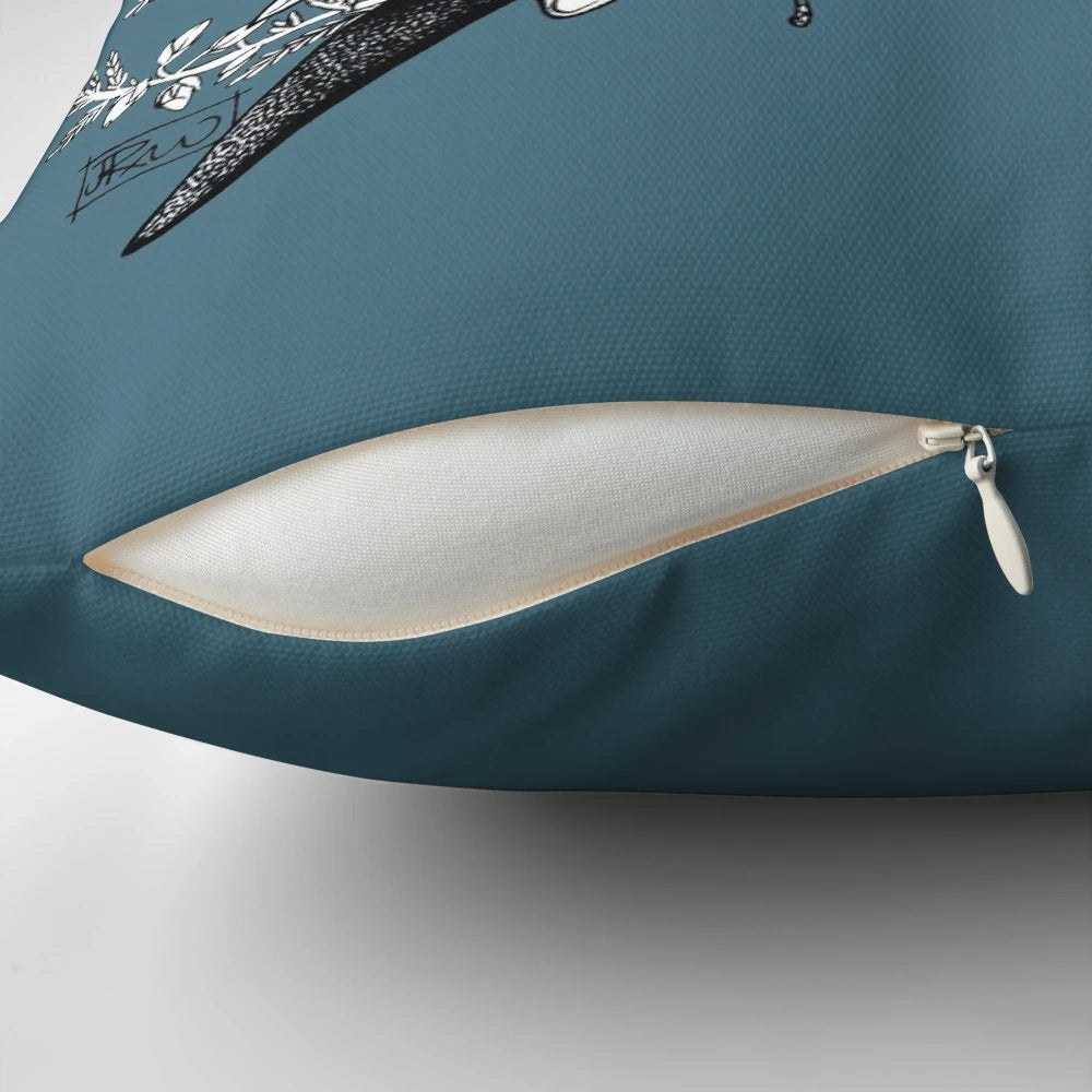 A throw pillow featuring a detailed ink drawing of orcas or killer whales swimming in the ocean with a floral pattern.