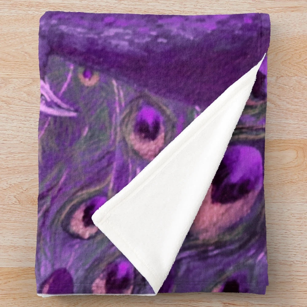 Vibrant purple and gold peacock plush blanket with iridescent feather design