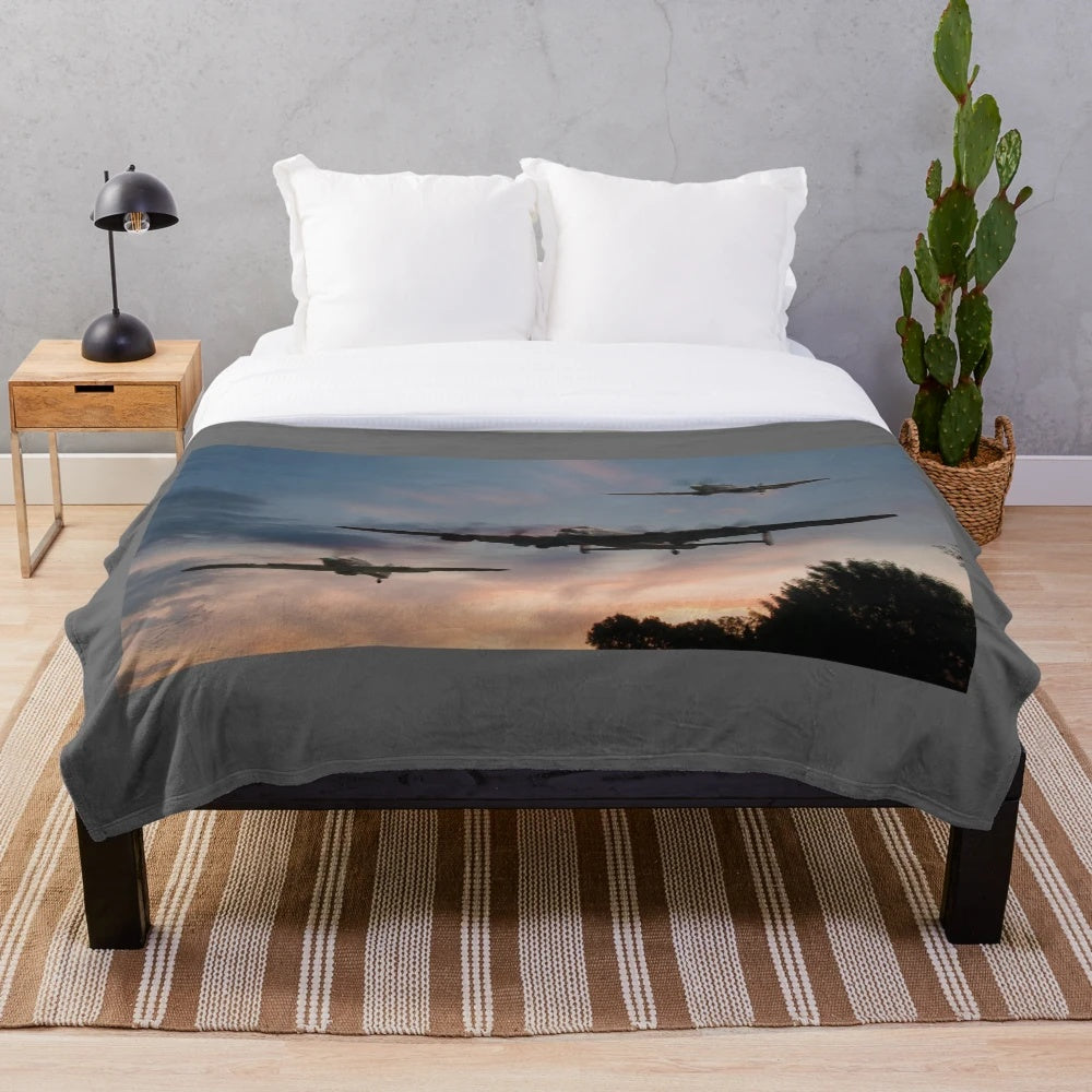 Plush blanket depicting a low pass of a Lancaster bomber from the Battle of Britain Memorial Flight at sunset