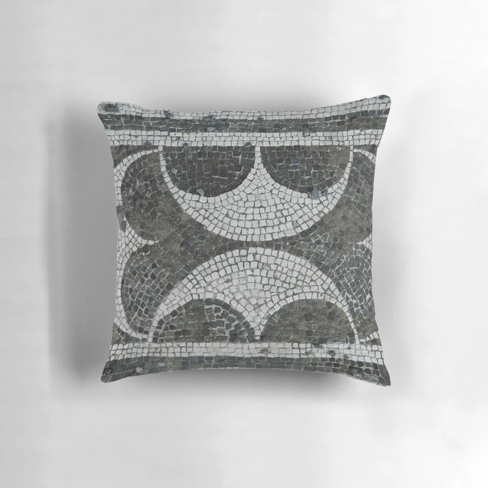 A decorative pillow featuring an intricate mosaic design inspired by ancient Pompeii architecture.