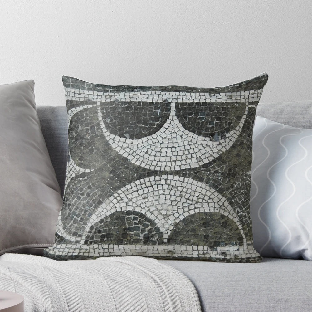A decorative pillow featuring an intricate mosaic design inspired by ancient Pompeii architecture.