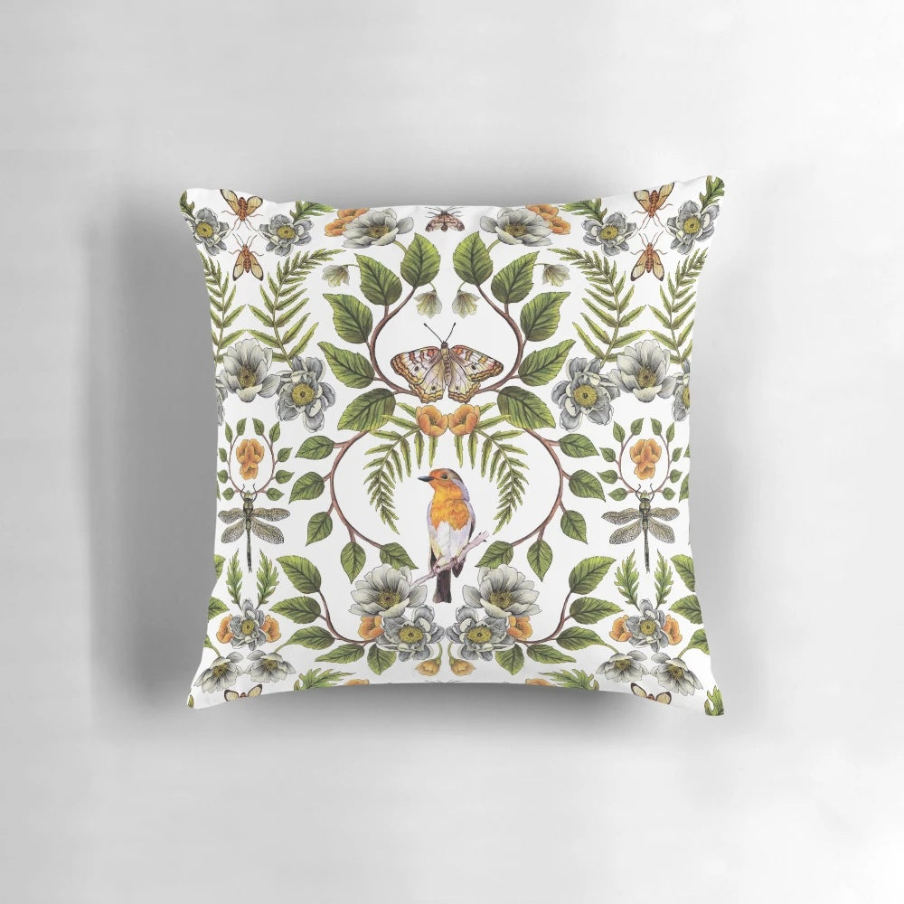 A beautiful spring-inspired floral and botanical pattern pillow featuring birds, moths, dragonflies, and flowers.