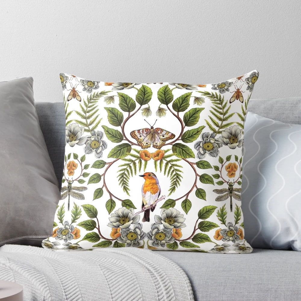 A beautiful spring-inspired floral and botanical pattern pillow featuring birds, moths, dragonflies, and flowers.