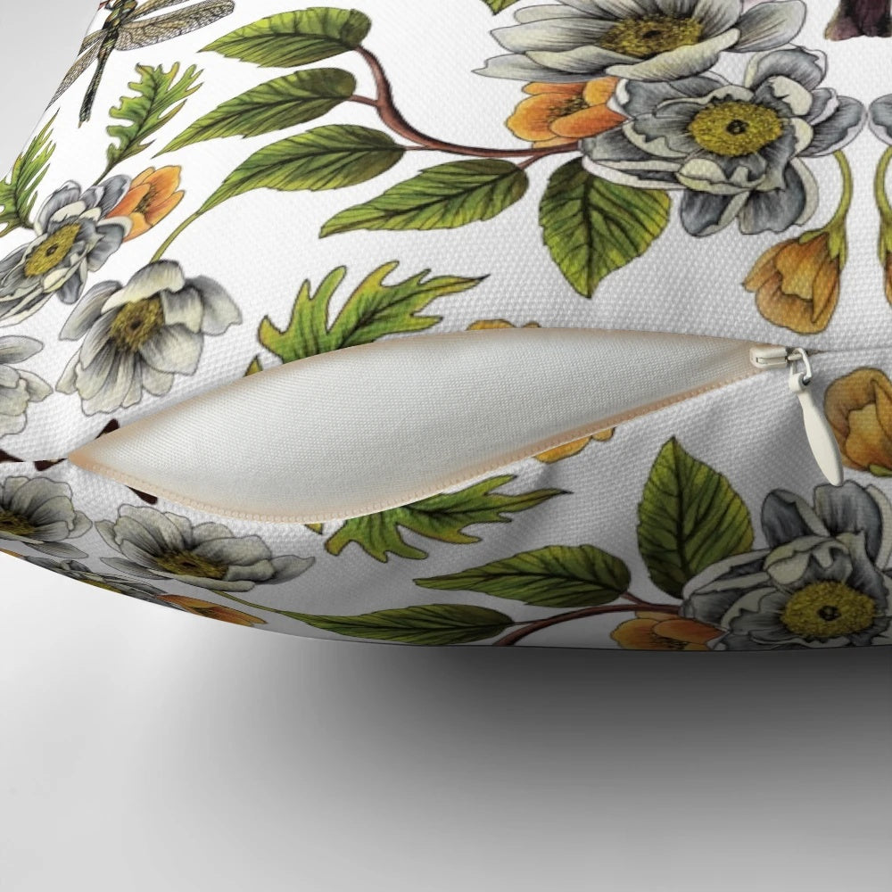 A beautiful spring-inspired floral and botanical pattern pillow featuring birds, moths, dragonflies, and flowers.