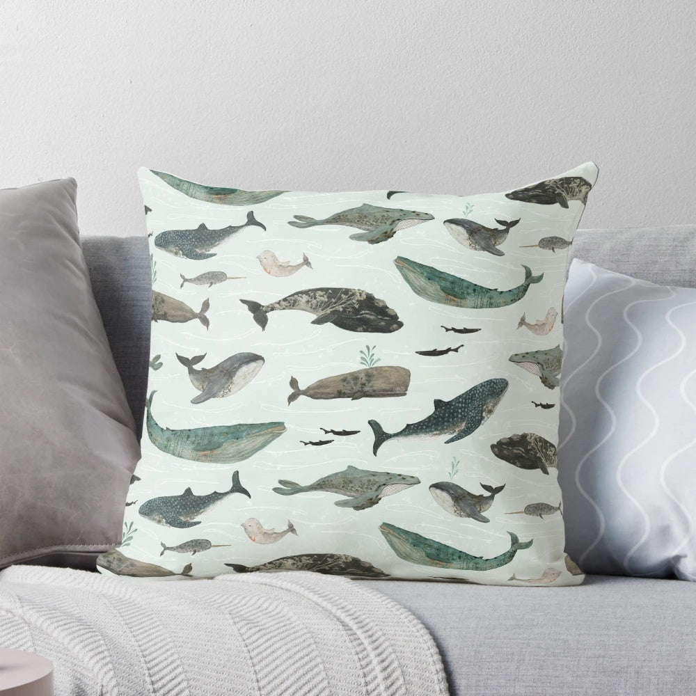 Vibrant tattooed whales printed on a plush throw pillow, perfect for adding a touch of ocean-inspired style to your home.