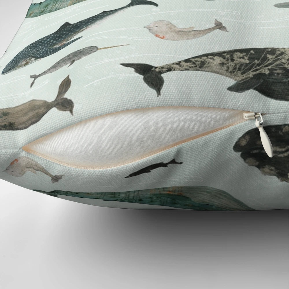 Vibrant tattooed whales printed on a plush throw pillow, perfect for adding a touch of ocean-inspired style to your home.