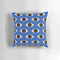 A vibrant blue and white patterned pillow featuring the iconic Turkish Evil Eye design, perfect for adding a touch of bohemian style to any room.