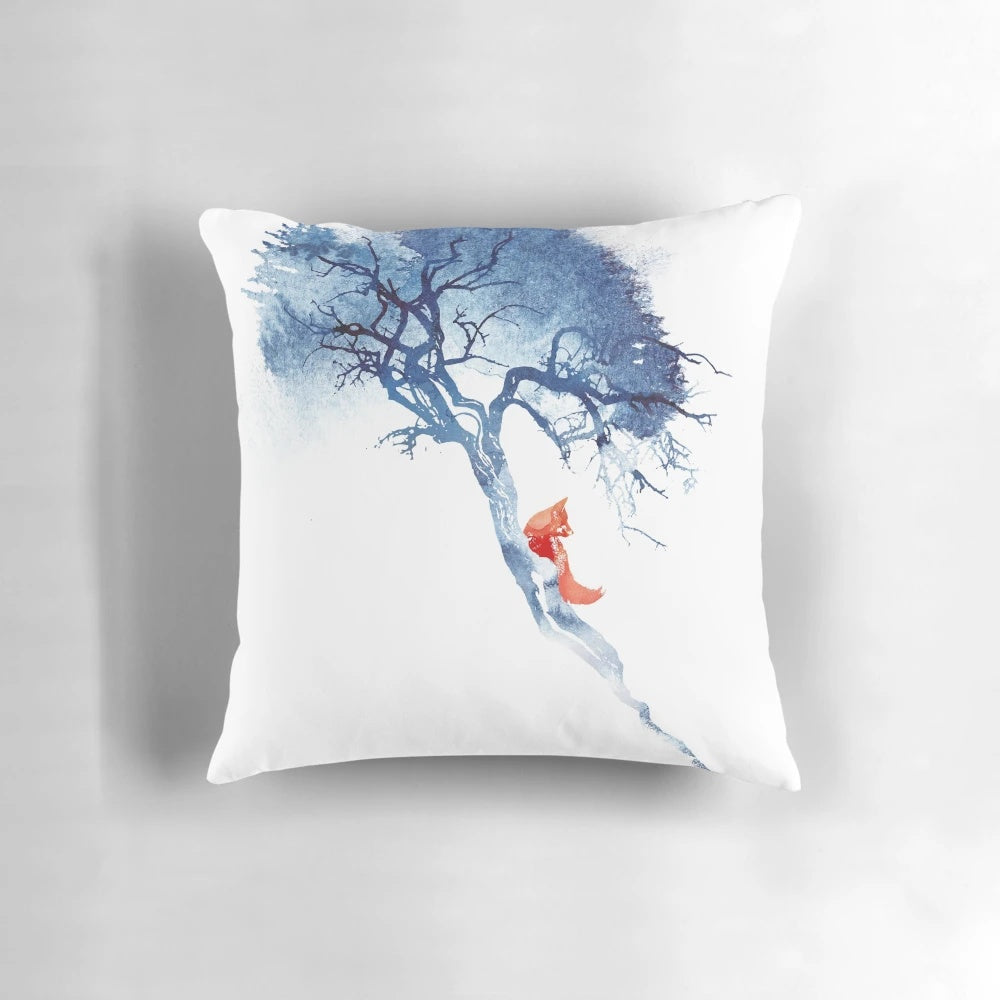 A decorative pillow featuring a beautiful watercolor painting of a fox in a tree against a blue and red sky background.
