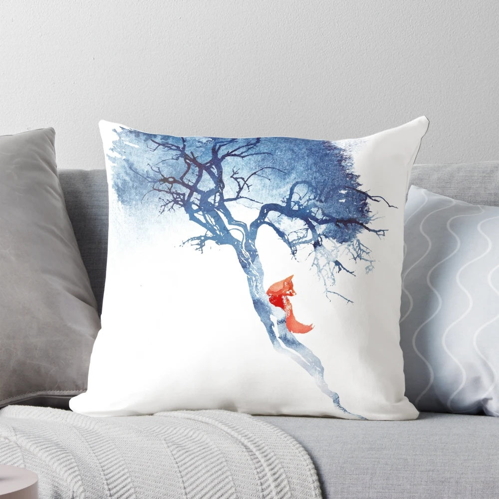 A decorative pillow featuring a beautiful watercolor painting of a fox in a tree against a blue and red sky background.