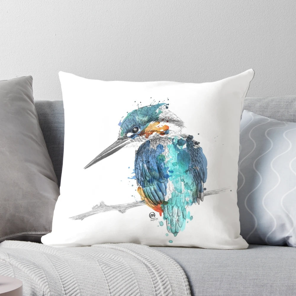 Vibrant watercolor painting of a flying kingfisher bird on a decorative pillow
