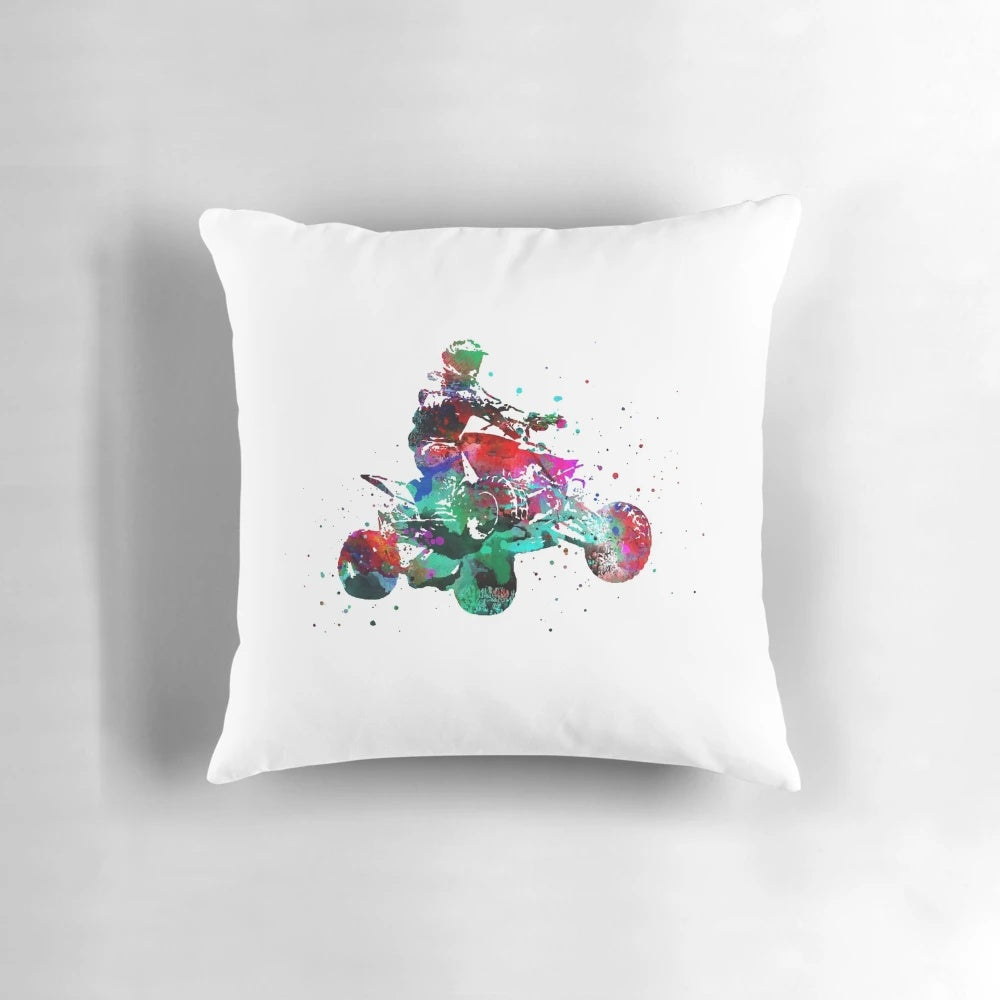 A vibrant, watercolor-style image of a quad bike racing through a rugged, outdoor environment, printed on a soft, comfortable pillow.