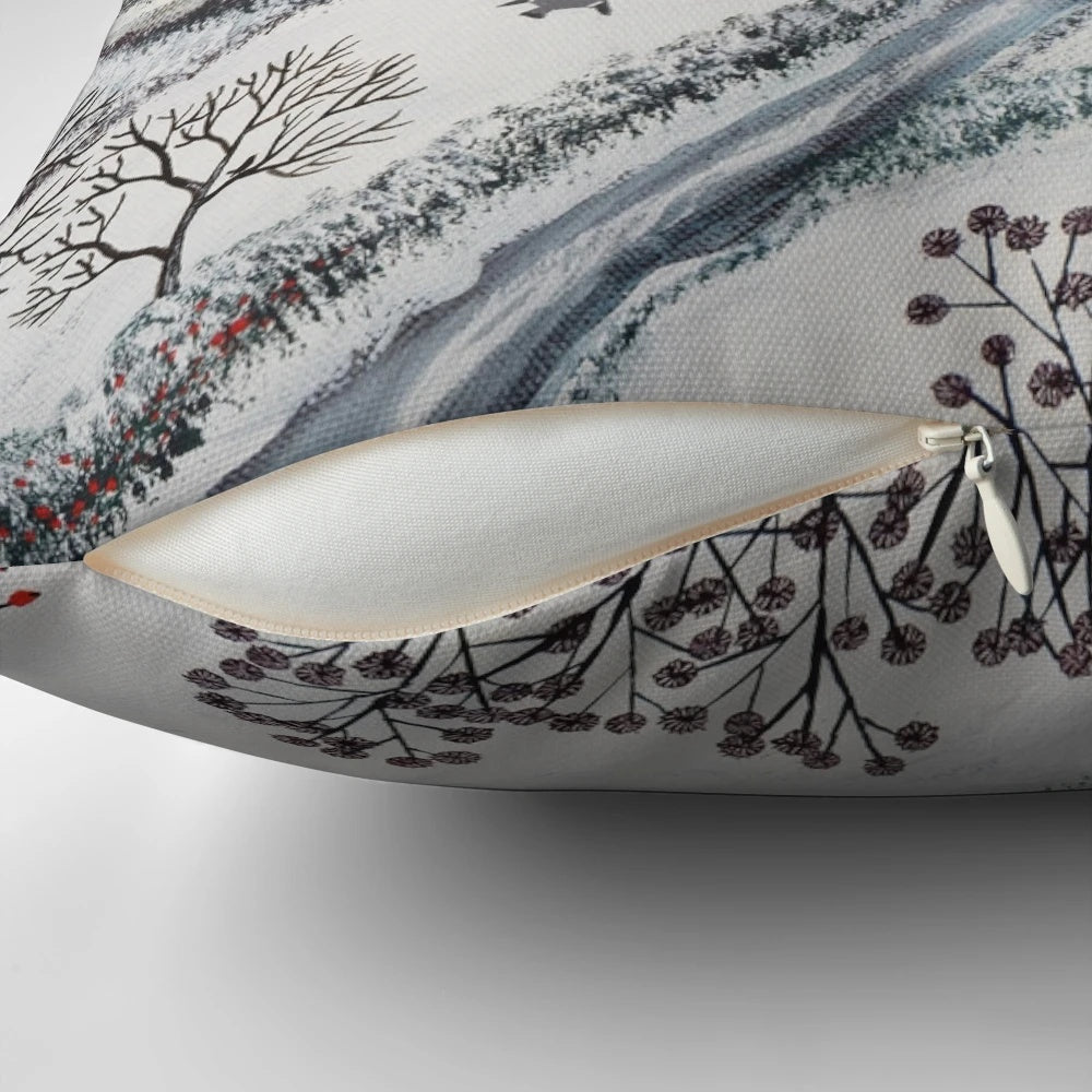 A cozy pillow featuring a winter landscape with snowy hills, houses, and birds in the snow.
