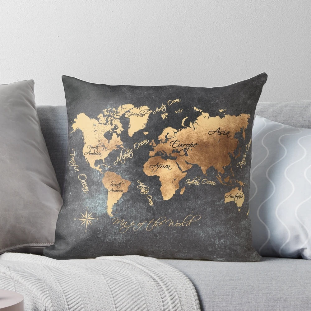 Decorative world map pillow in gold and black, featuring a detailed cartographic design for the ultimate traveler's home accessory.