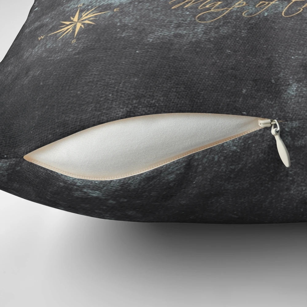 Decorative world map pillow in gold and black, featuring a detailed cartographic design for the ultimate traveler's home accessory.