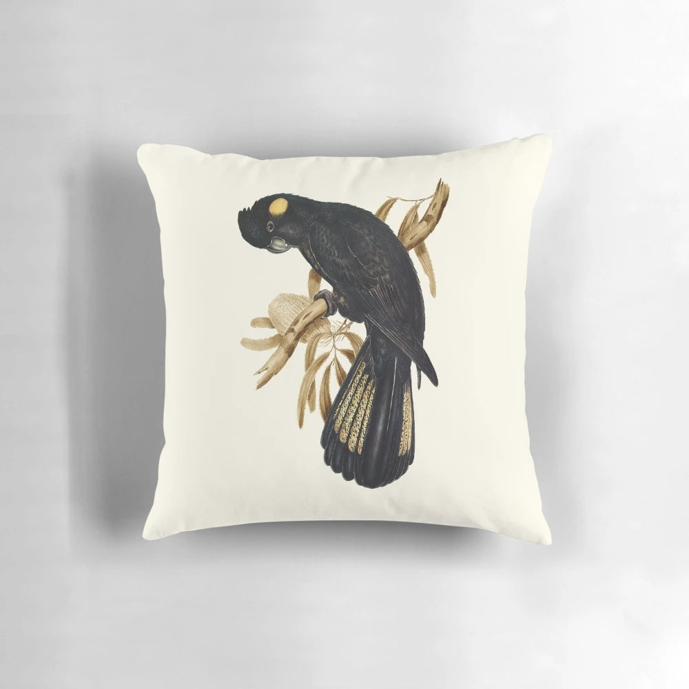 Decorative pillow featuring a photographic image of a yellow-tailed black cockatoo