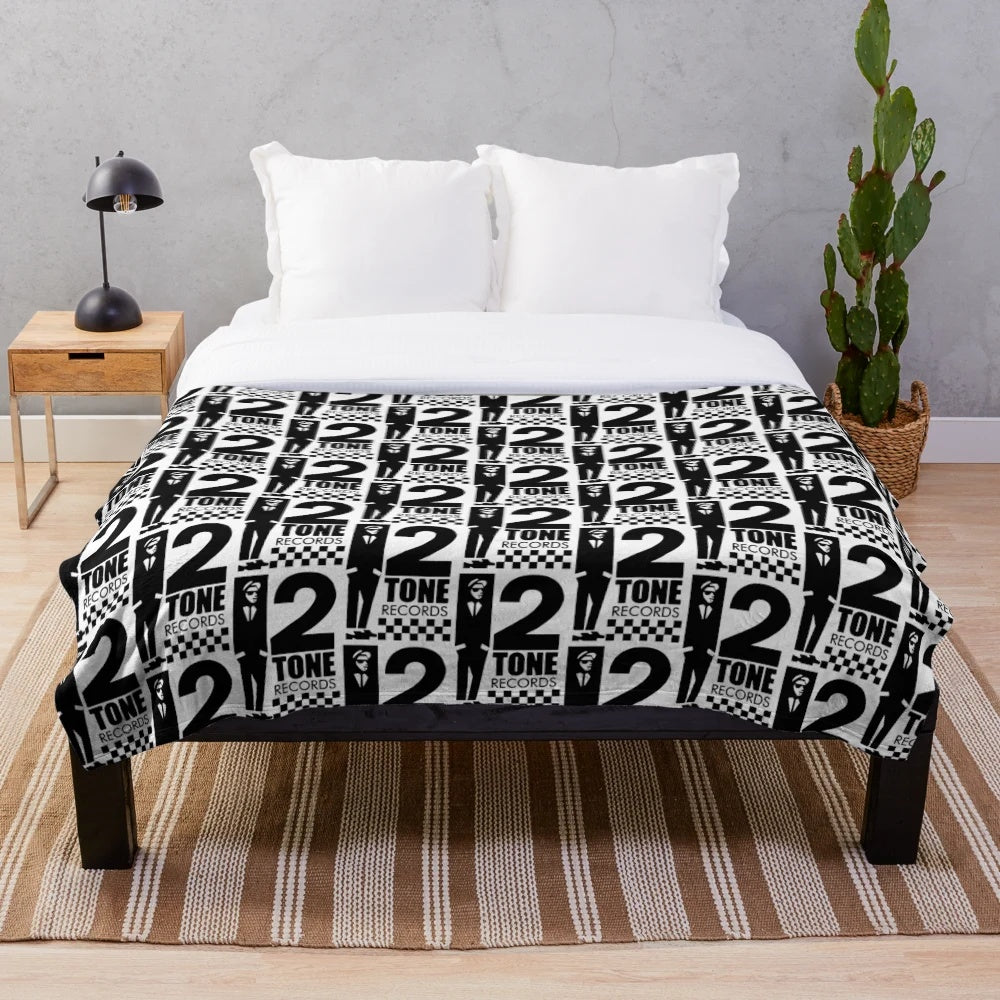 Black and white plush blanket with 2 tone records design