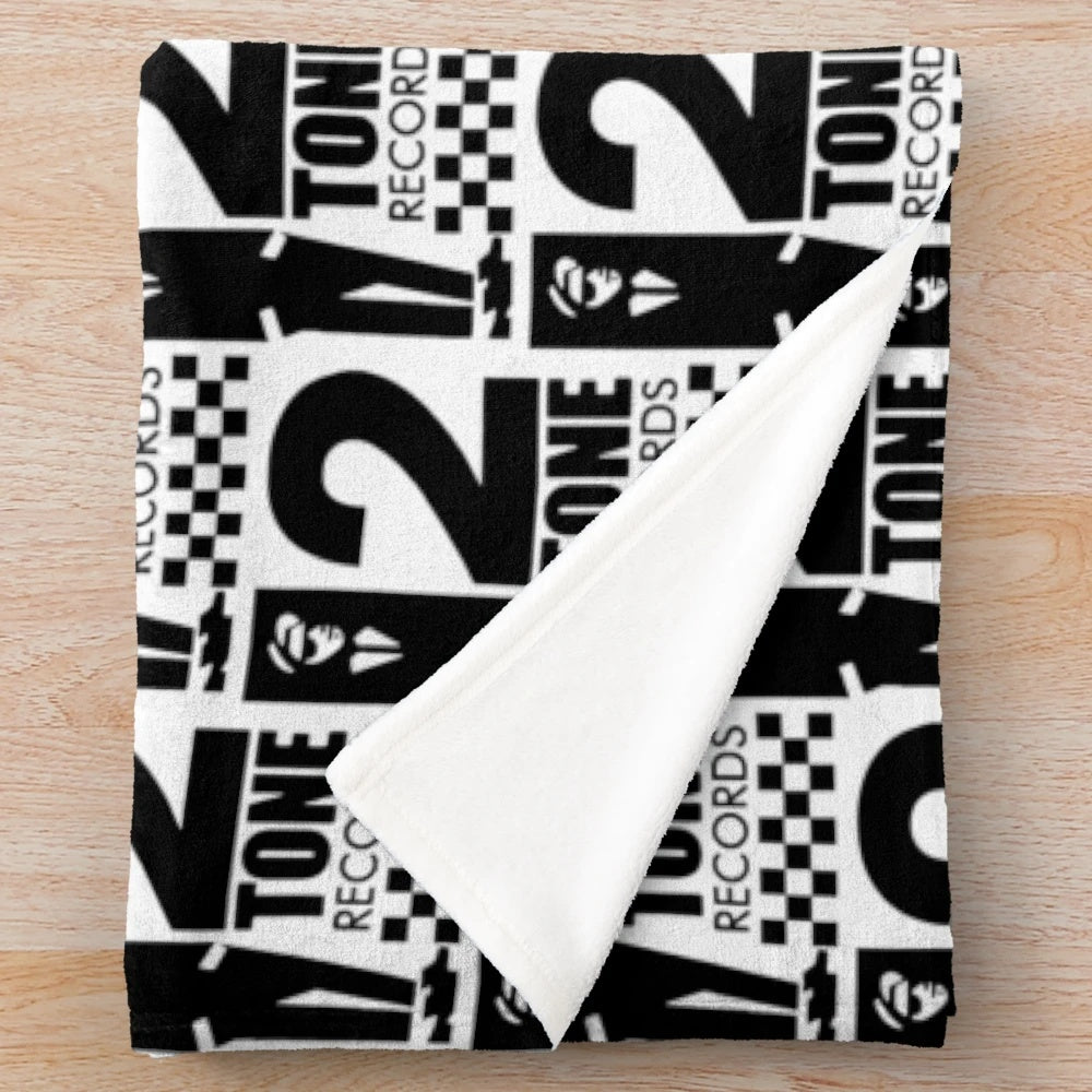 Black and white plush blanket with 2 tone records design
