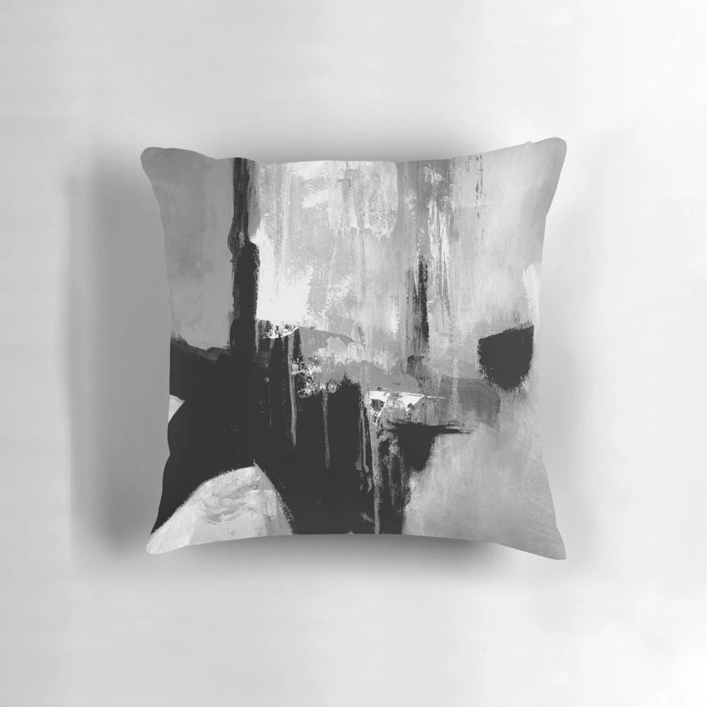Striking abstract black and white pillow with dynamic grayscale stripes