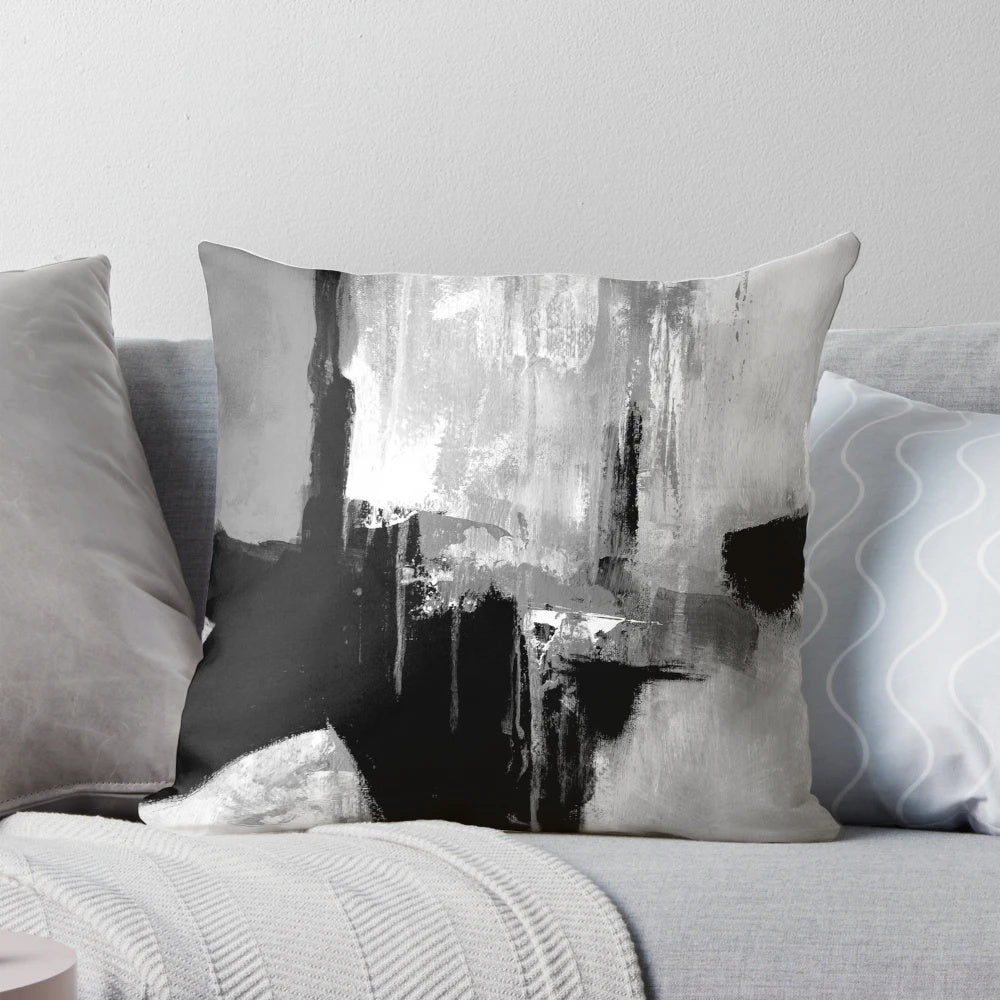 Striking abstract black and white pillow with dynamic grayscale stripes