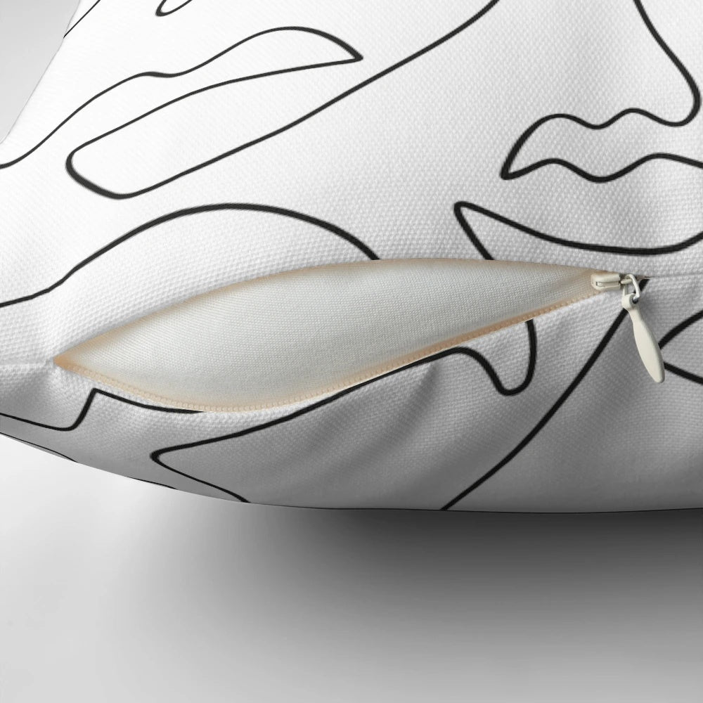 Stylish abstract face line art printed on a soft, high-quality pillow