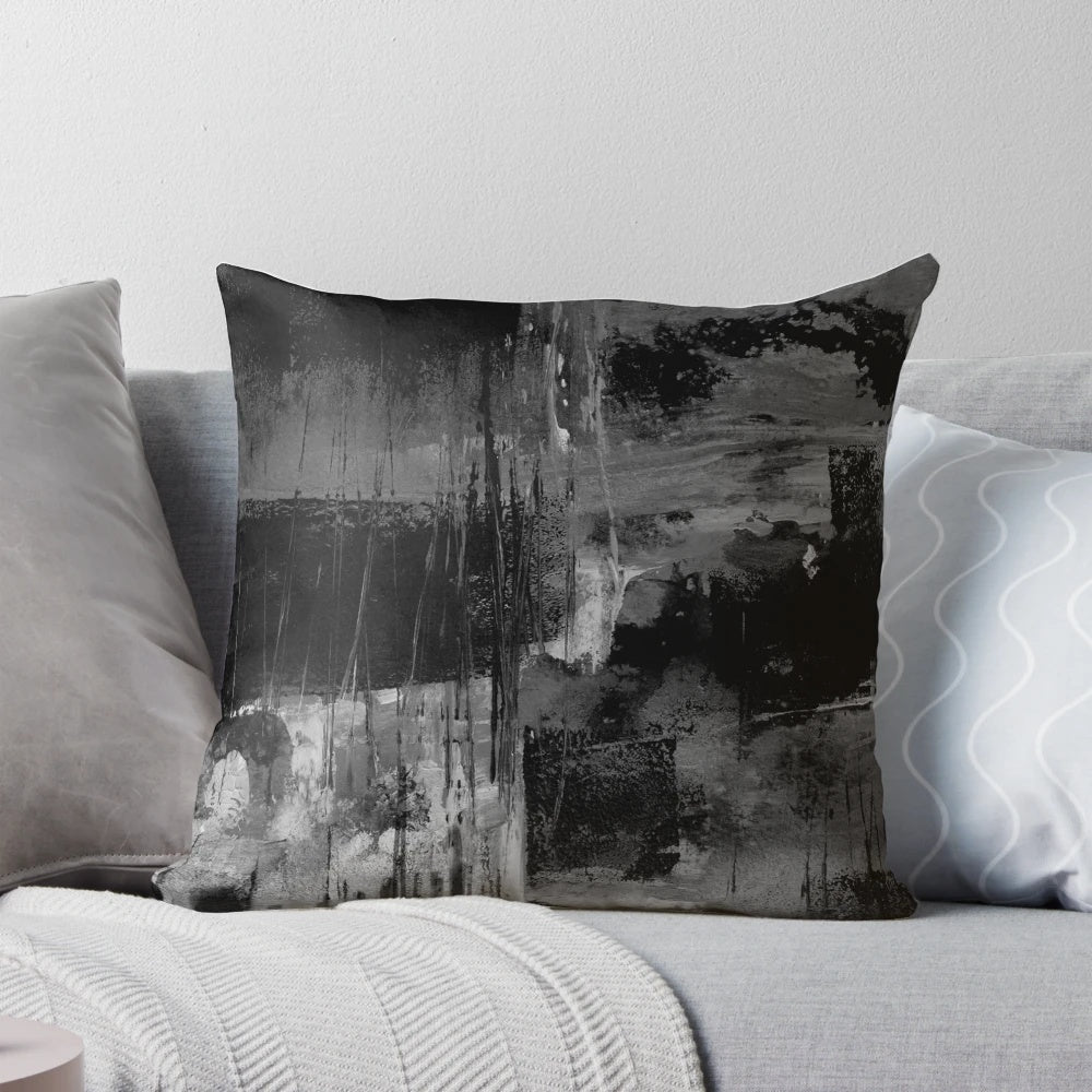 Abstract gray and black pillow with dynamic stripes and gradient design