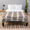 Closeup of an abstract patterned plush blanket in neutral colors