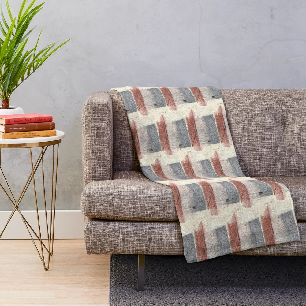 Closeup of an abstract patterned plush blanket in neutral colors