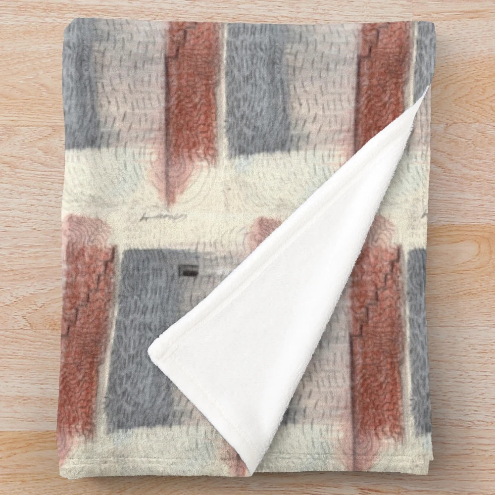 Closeup of an abstract patterned plush blanket in neutral colors