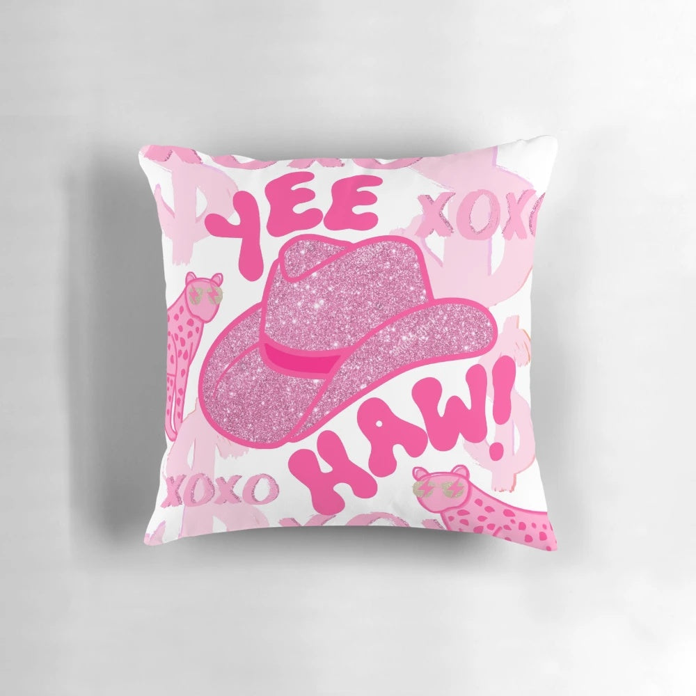 Decorative "Yeehaw!" pillow with a pink cowgirl hat and cheetah print design, perfect for the modern, preppy cowgirl
