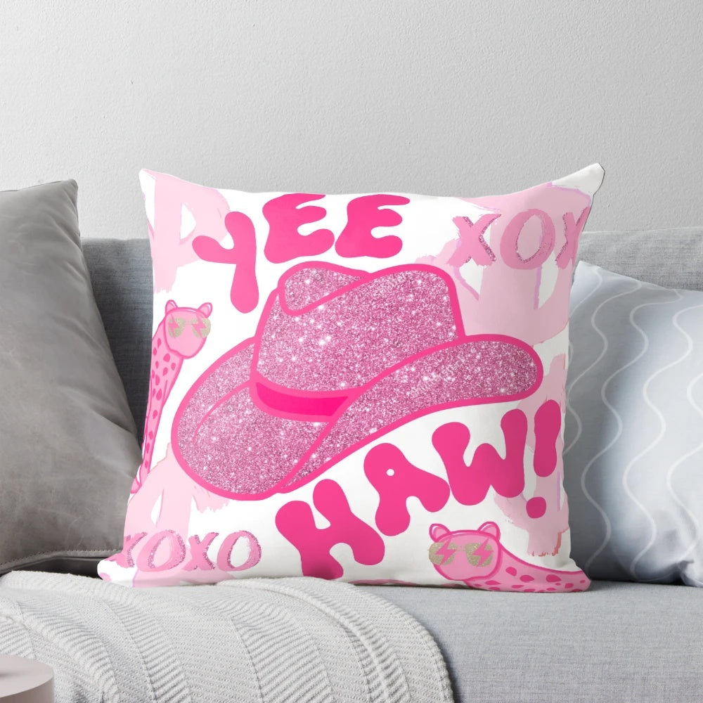Decorative "Yeehaw!" pillow with a pink cowgirl hat and cheetah print design, perfect for the modern, preppy cowgirl