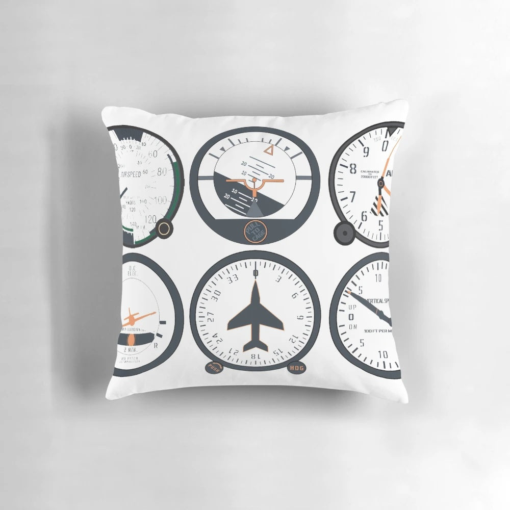 Closeup of a basic six flight instruments pillow, including attitude indicator, altimeter, airspeed indicator, and more.