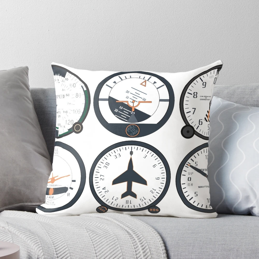 Closeup of a basic six flight instruments pillow, including attitude indicator, altimeter, airspeed indicator, and more.