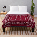 Burgundy plush blanket with bandana pattern