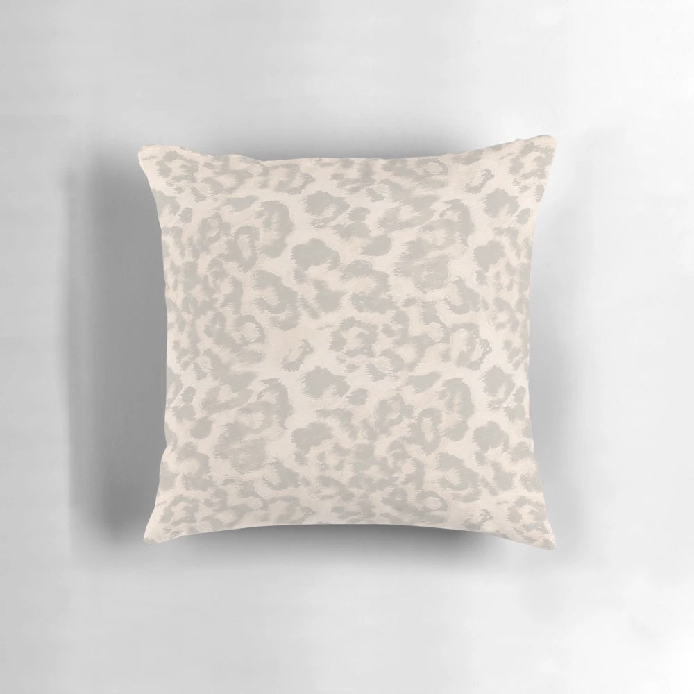 Beige leopard print pillow with a modern, fashionable animal skin design