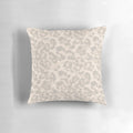 Beige leopard print pillow with a modern, fashionable animal skin design