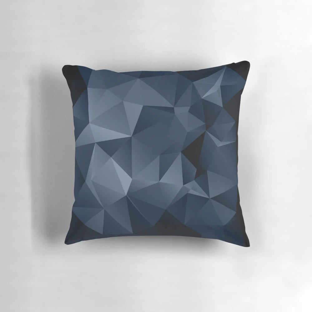 Black and blue polygonal pattern design on a decorative pillow
