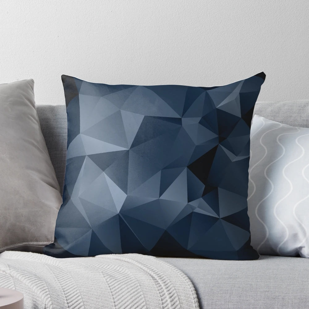 Black and blue polygonal pattern design on a decorative pillow