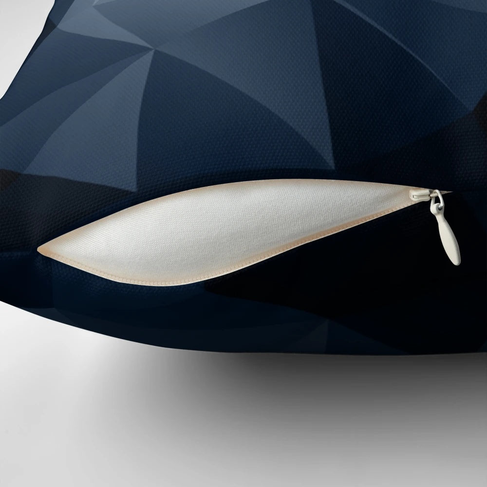 Black and blue polygonal pattern design on a decorative pillow