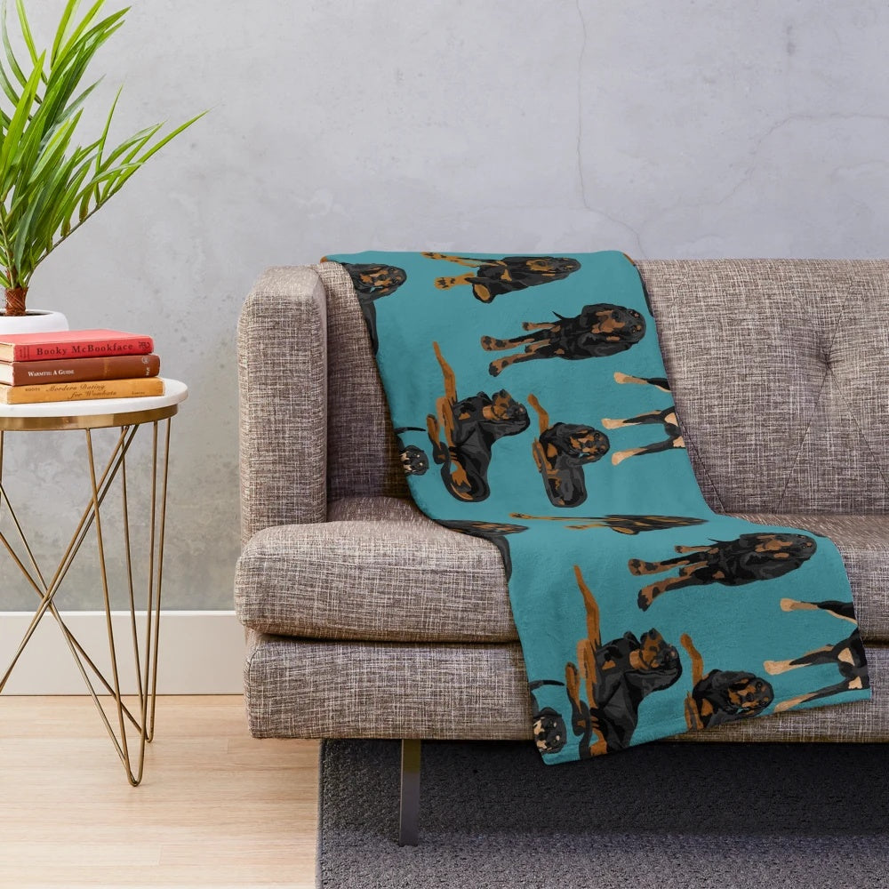 Black and tan coonhound printed on a teal plush blanket